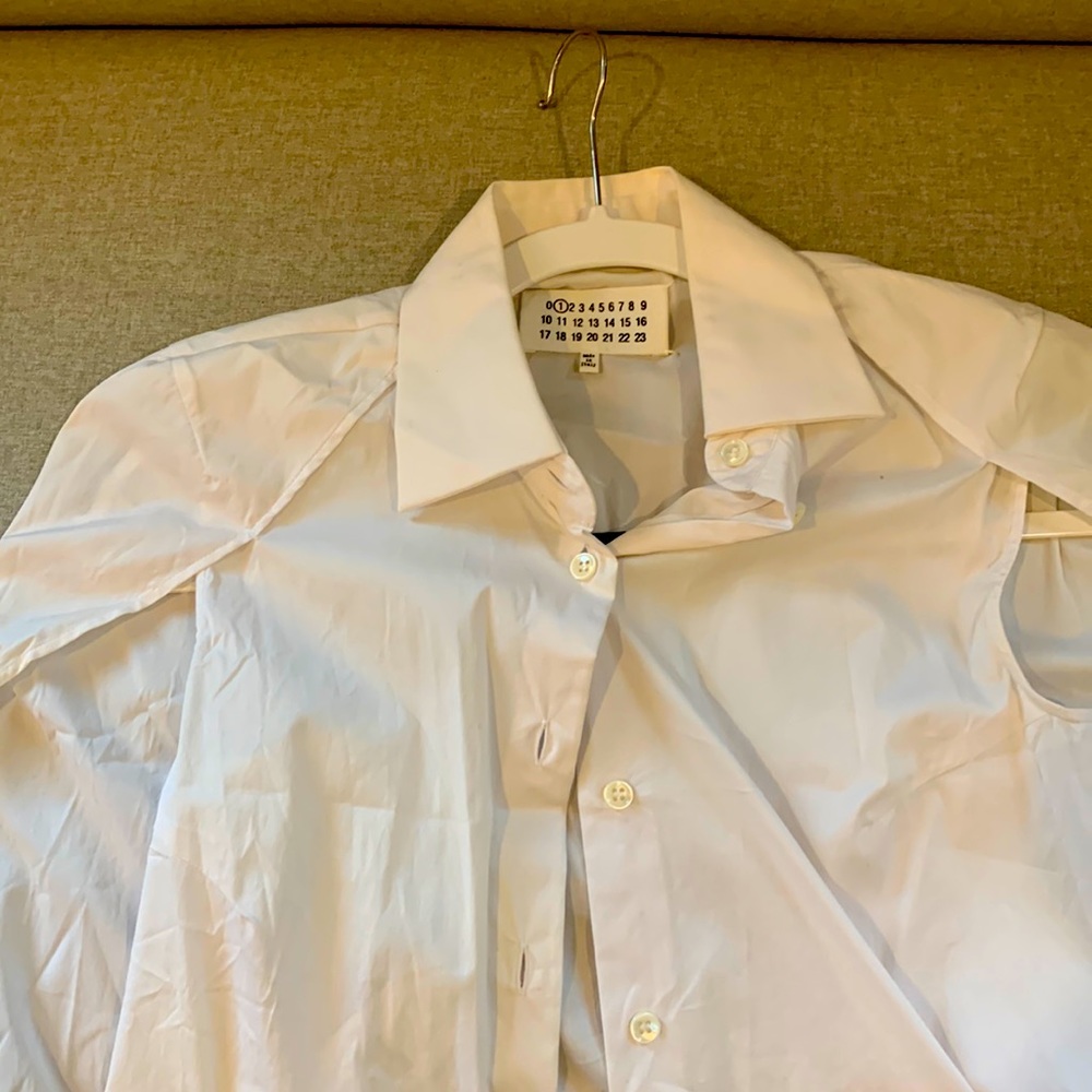I am selling a white button down tunic